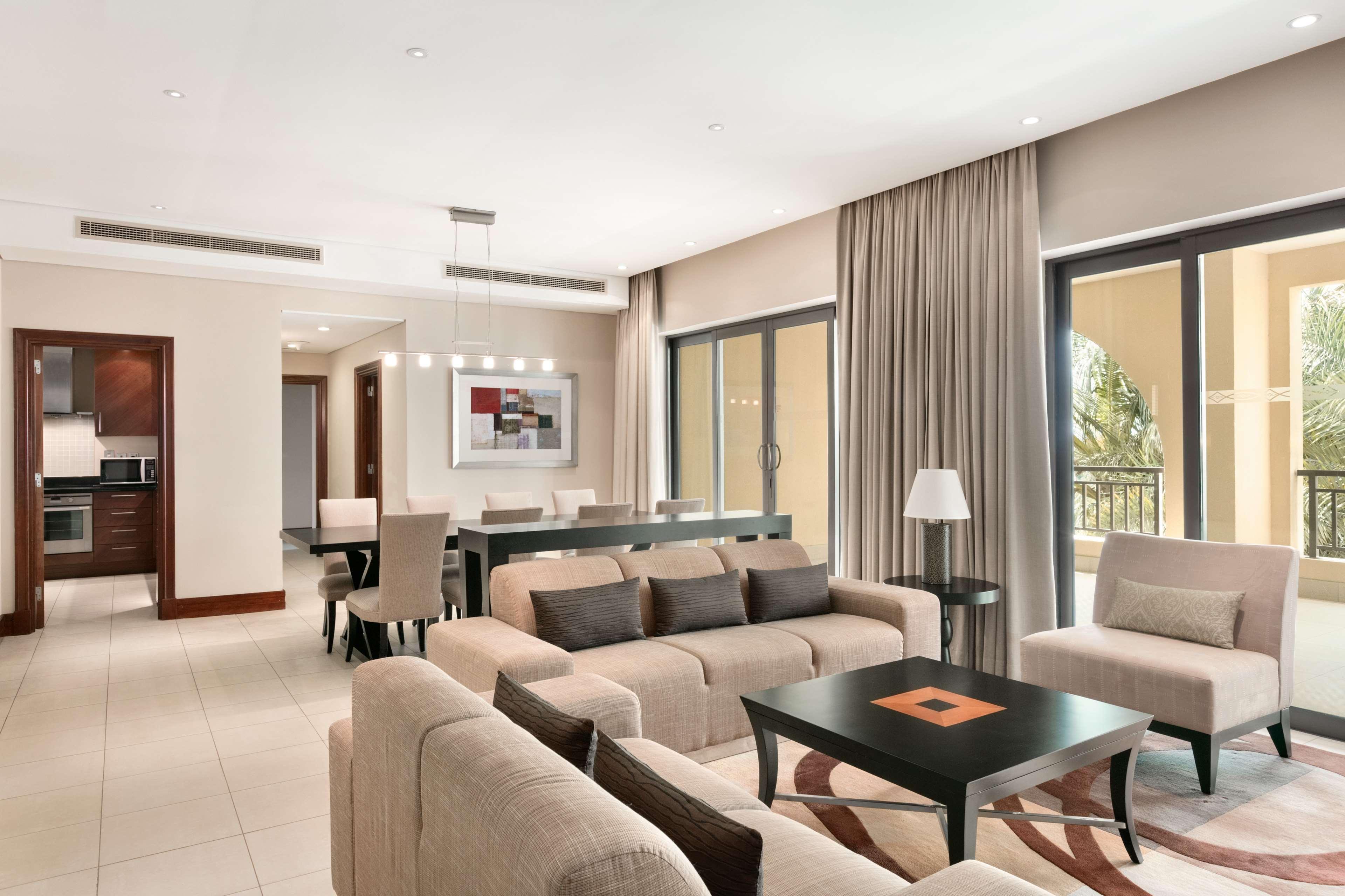 Shangri-La Qaryat Al Beri, Abu Dhabi Exterior photo A living room in a suite at the Jumeirah Beach Hotel